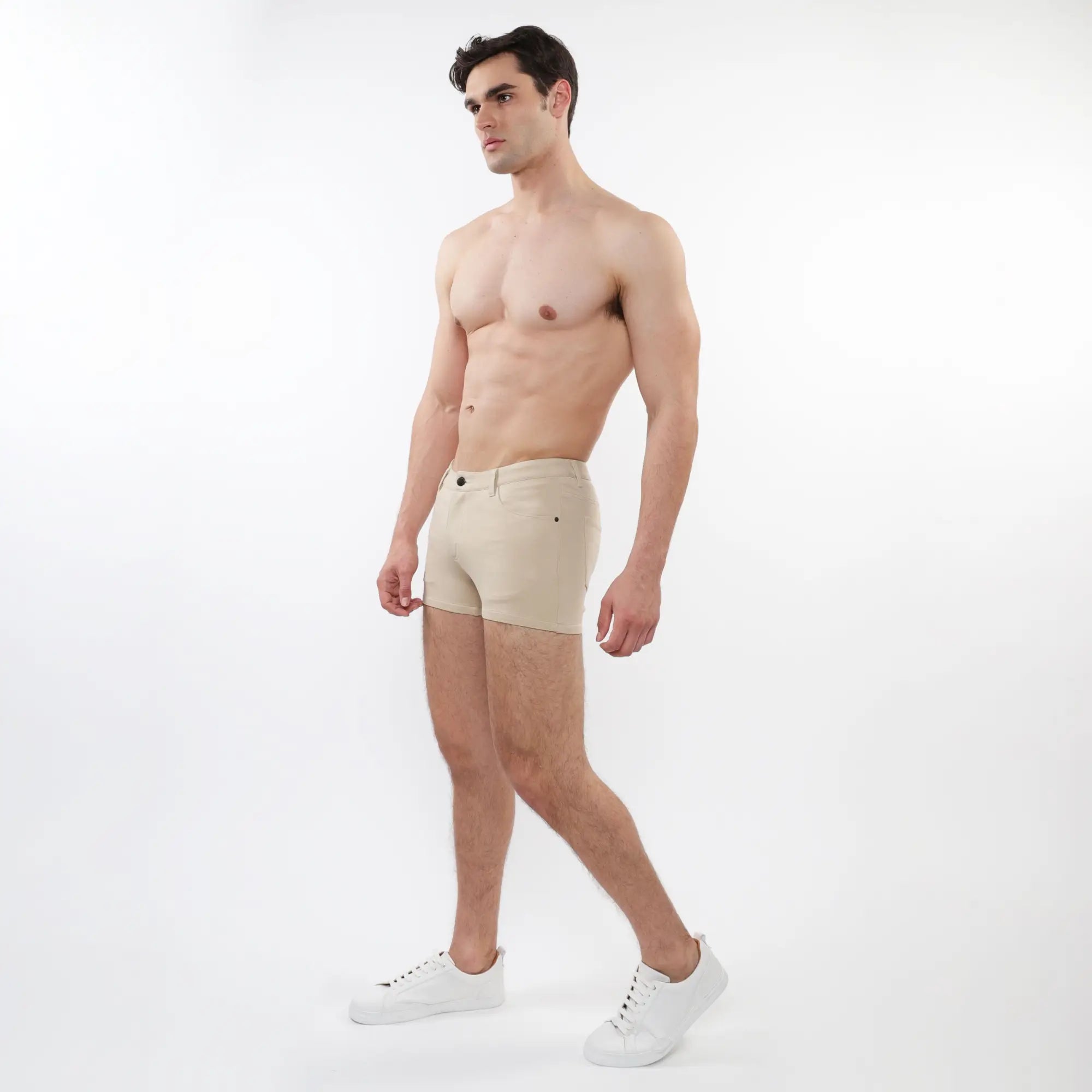 Beige 3 inch stretch knit short briefs with classic five pocket design and button closure