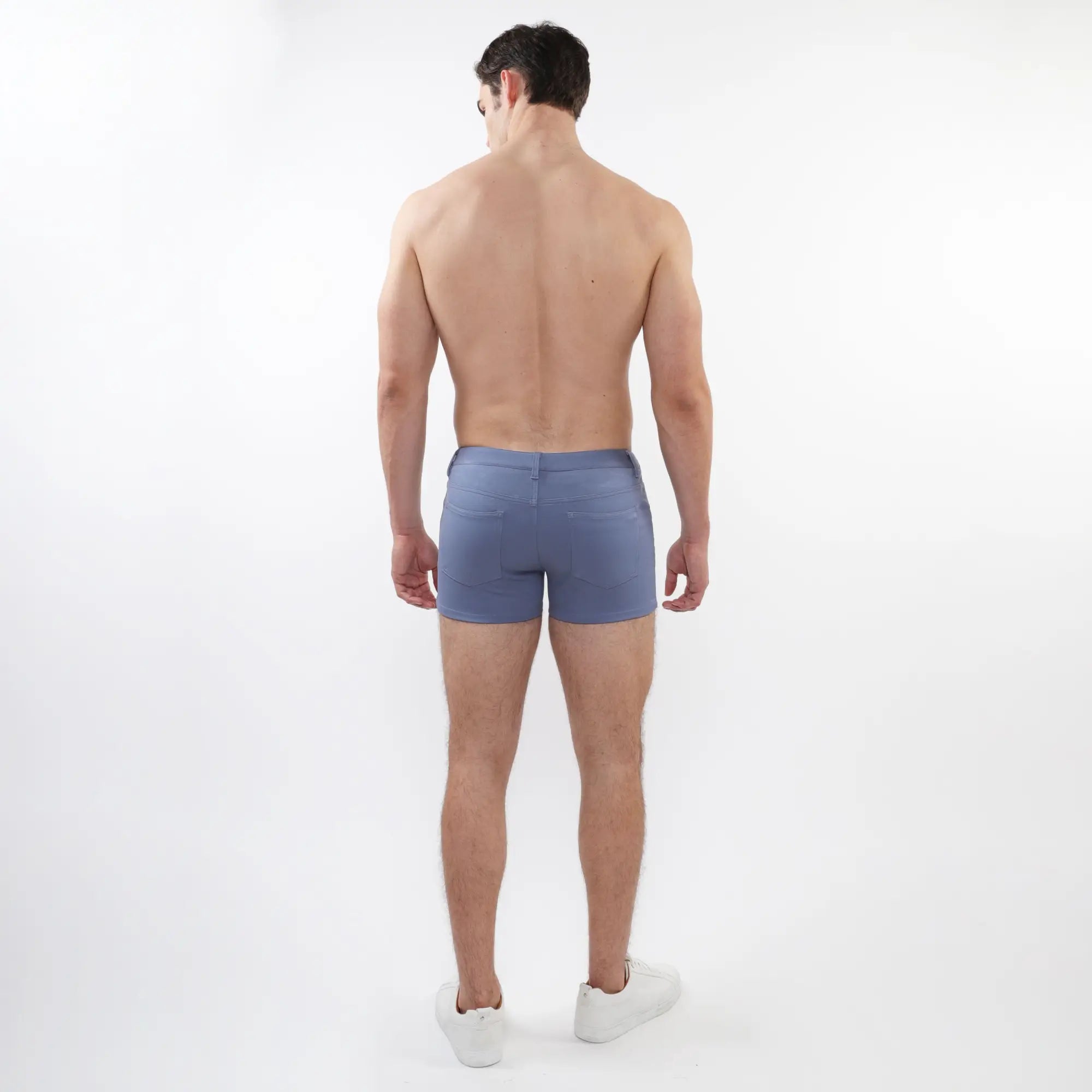 Blue denim 3 inch stretch knit shorts with classic fit and rear pockets shown from the back side