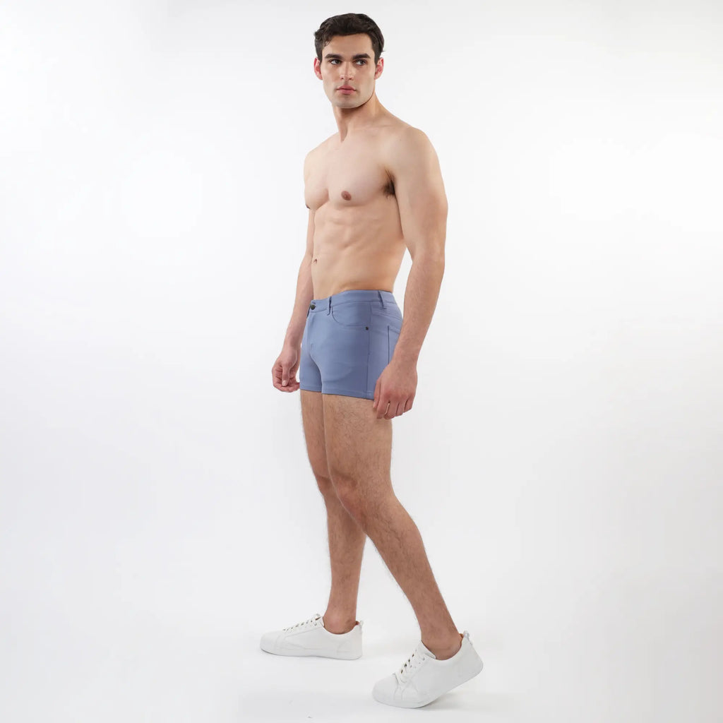 A pair of light blue 3 inch stretch knit shorts for men with a tailored fit and subtle stitching details
