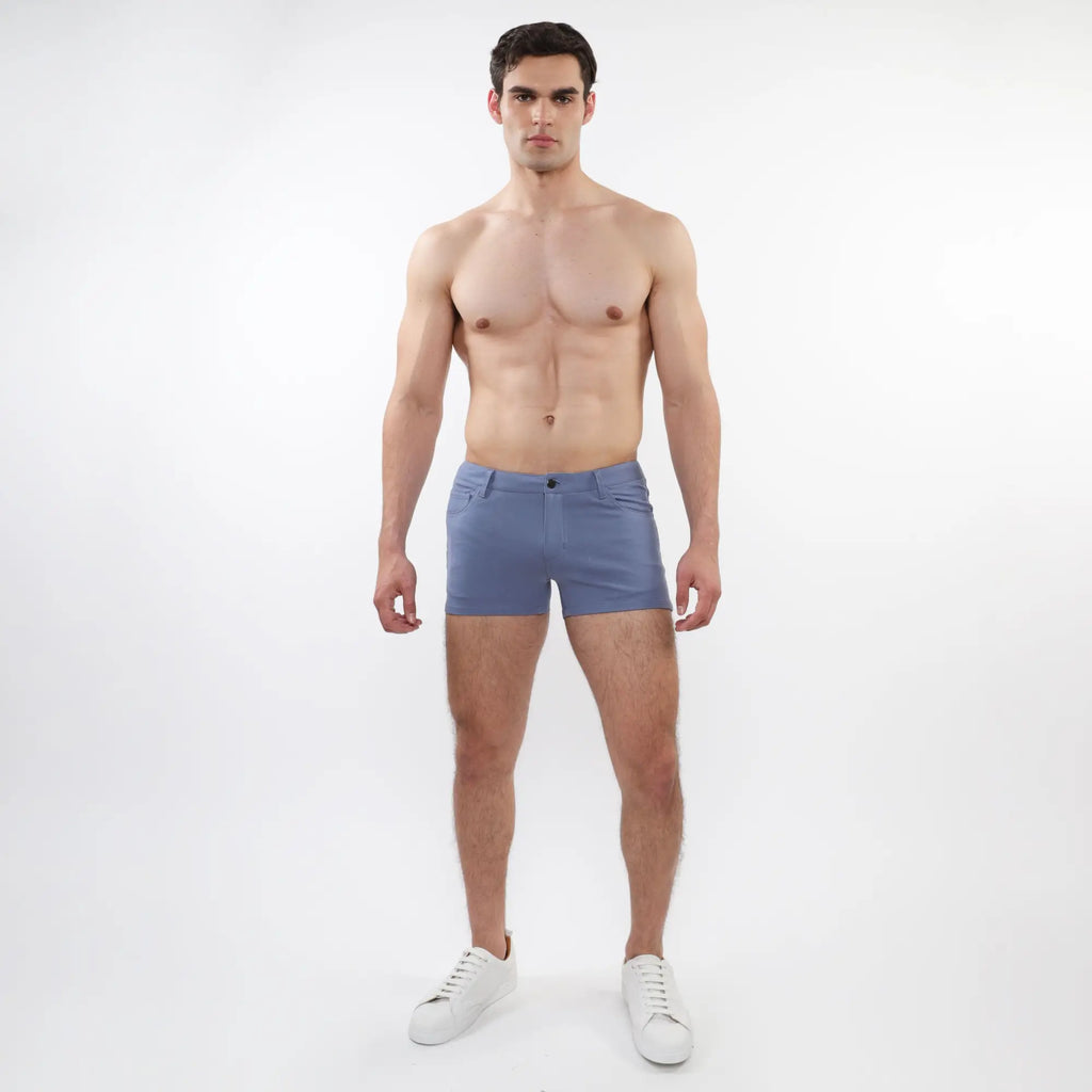 A pair of light blue 3 inch stretch knit shorts with a slim fit five-pocket design and button closure for men
