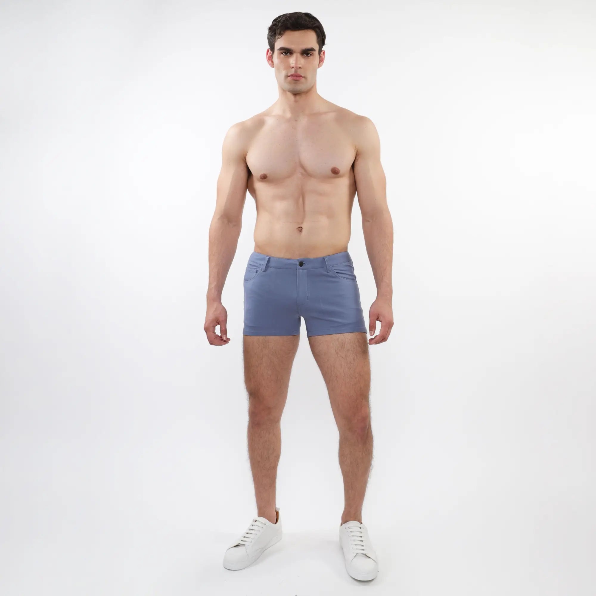 A pair of light blue 3 inch stretch knit shorts with a slim fit five-pocket design and button closure for men