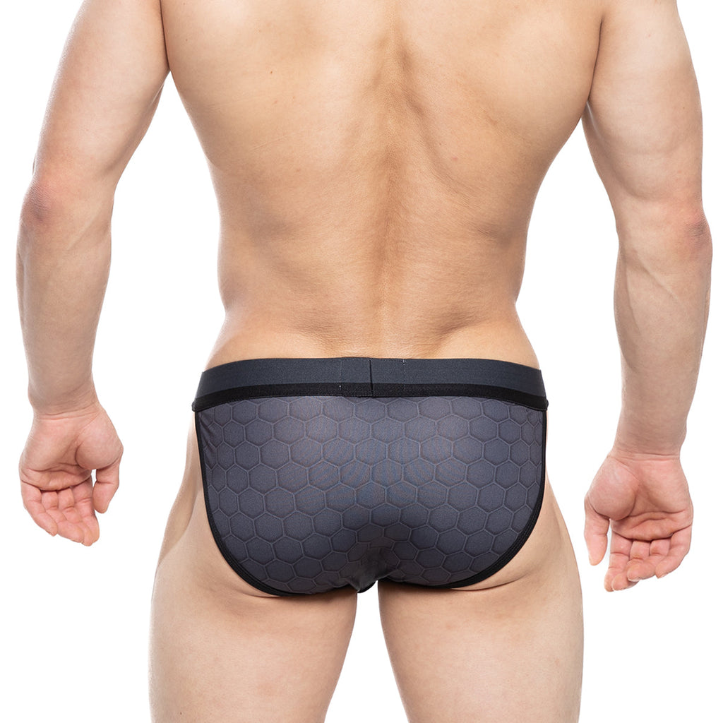 MetroMaleWear Armour Sports Bikini 3004-M41 black swim trunks with hexagonal pattern and solid black waistband