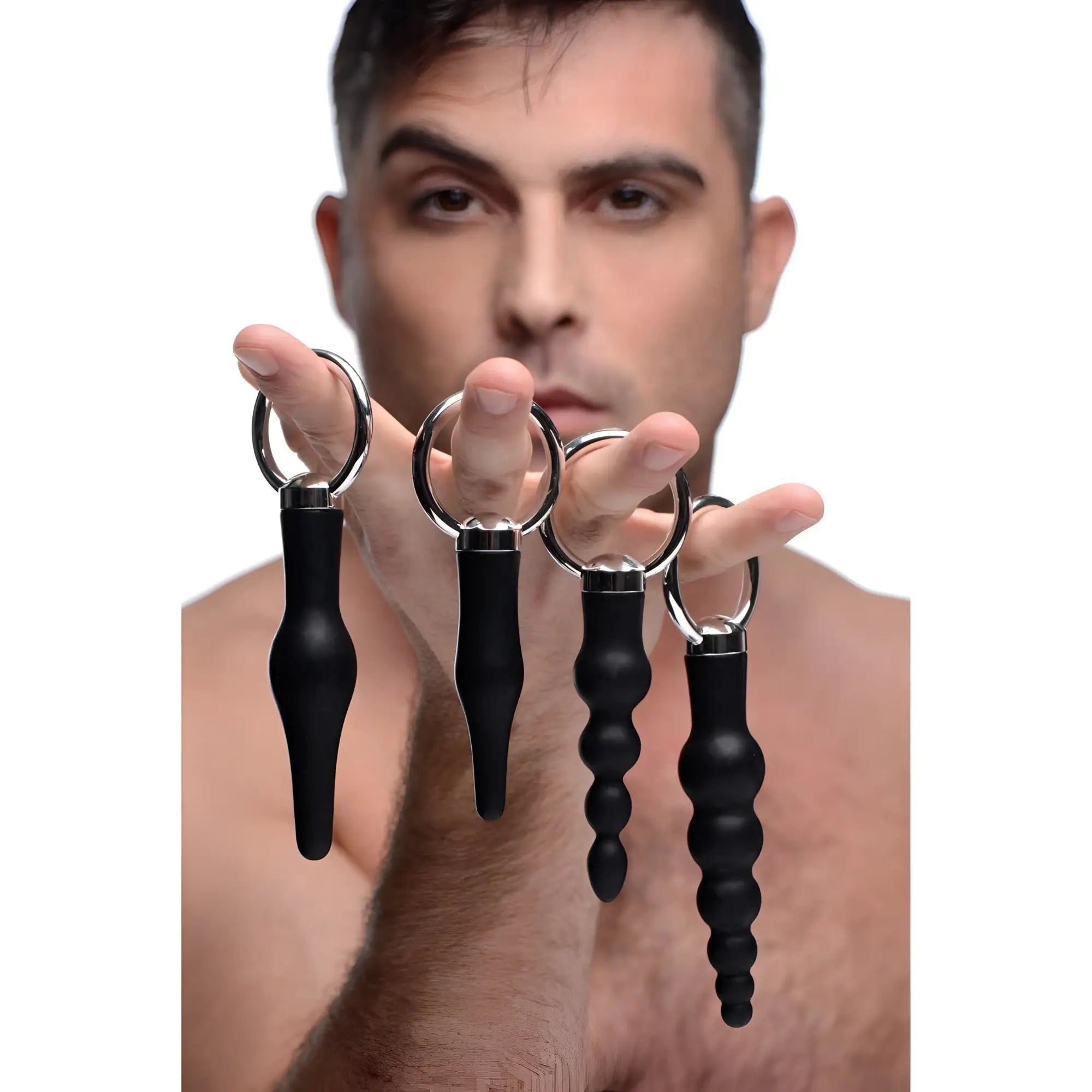 Set of four black silicone anal plugs with silver metal rings from the 4 piece silicone anal ringed rimmer set