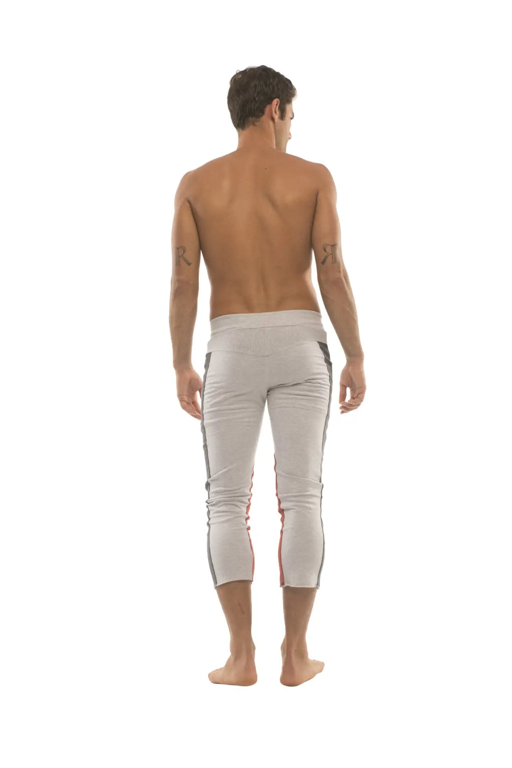 White athletic capri yoga pants with black and red side stripes and zipper pockets for men