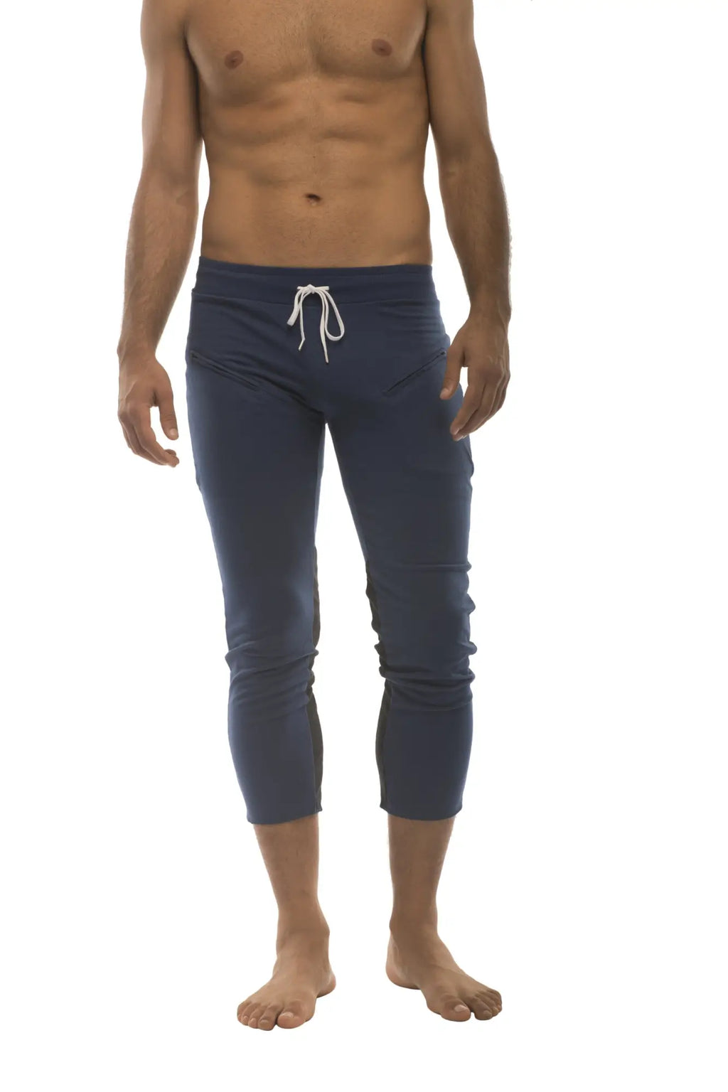 Men’s navy blue capri yoga pants with white drawstring waistband and zipper pockets for athletic use