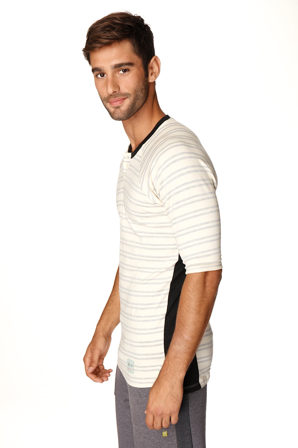 A men’s short-sleeved henley tee with grey double stripes black collar and side panels in french terry loop material