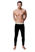 Black slim-fit crosstrain thermal yoga pant with white waistband featuring green and gray geometric patterns