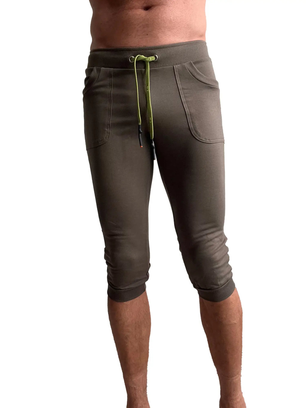 Olive green cuffed yoga pants in capri length with lime green drawstring and side pockets for comfortable wear