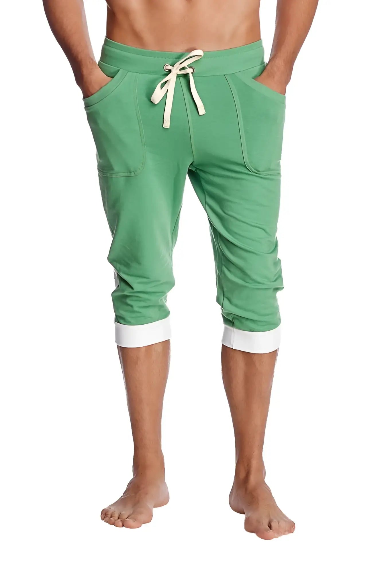Cuffed yoga pants in bamboo green with white drawstring and contrasting white cuffs made from soft fabric