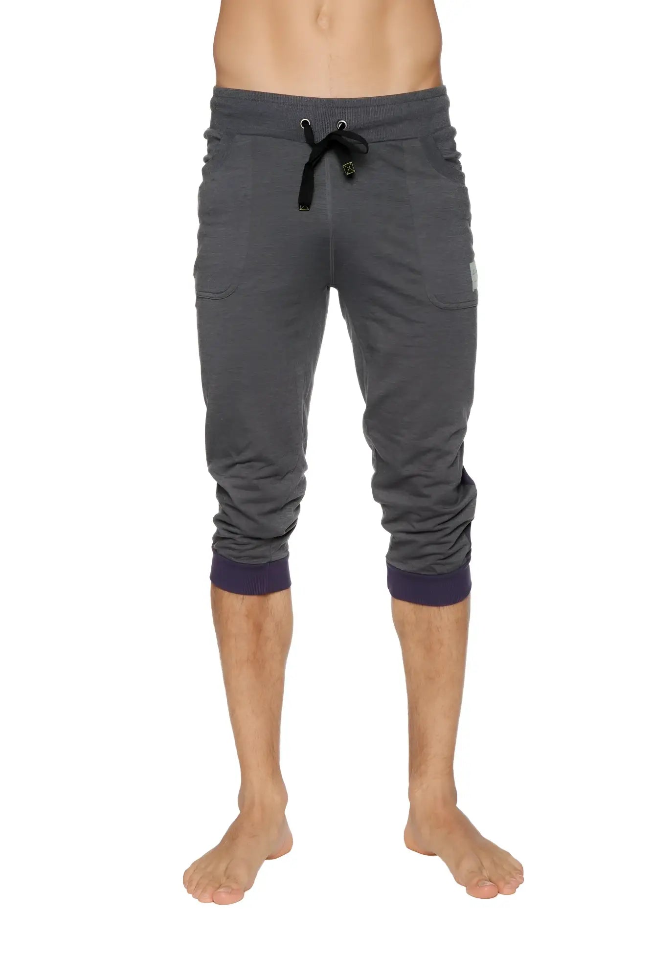 Cuffed yoga pants in charcoal heathered fabric with navy ribbed cuffs and black drawstring waistband