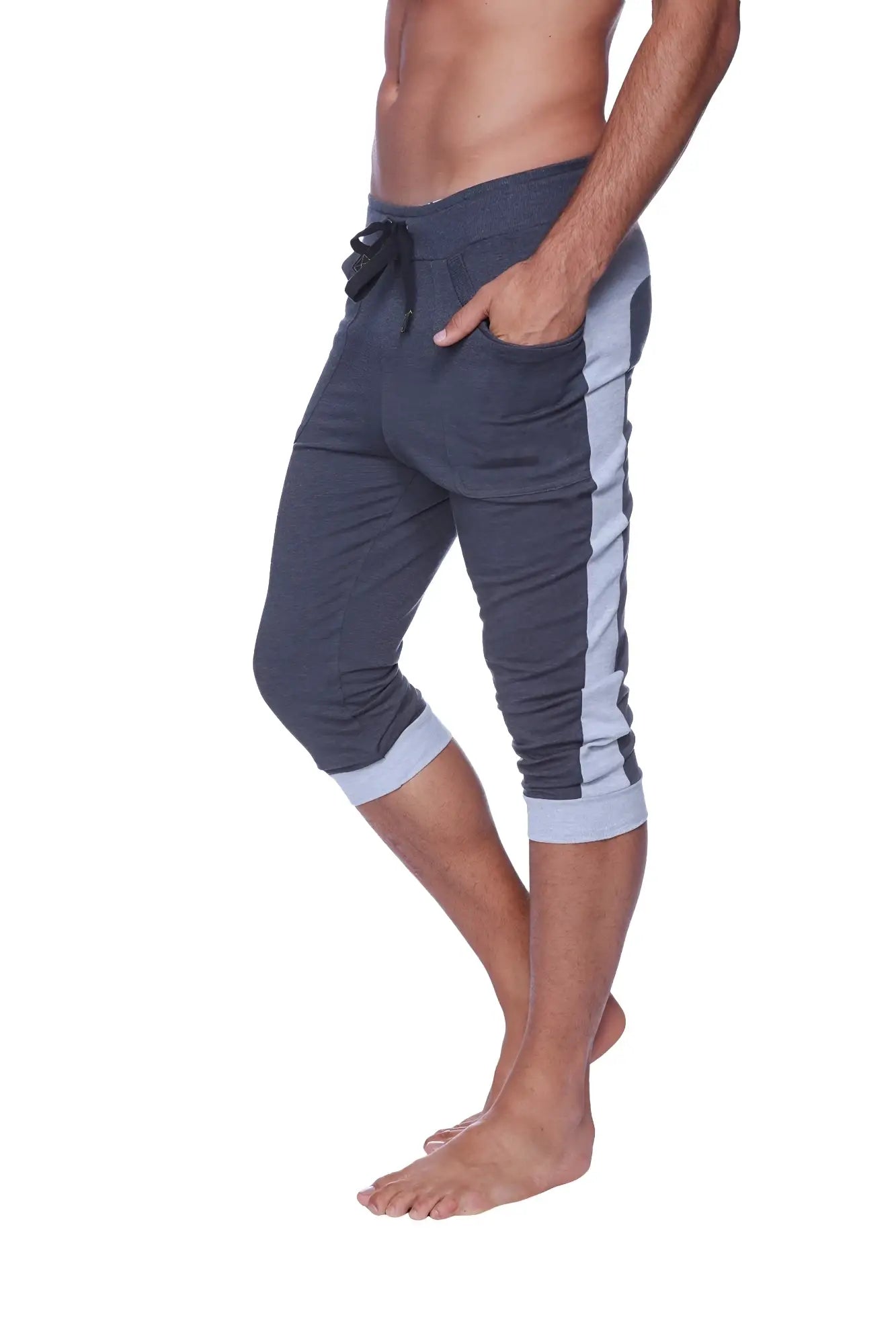 Mens cuffed yoga pants in charcoal with heather grey featuring dark gray capri joggers with light blue side stripes and ribbed cuffs