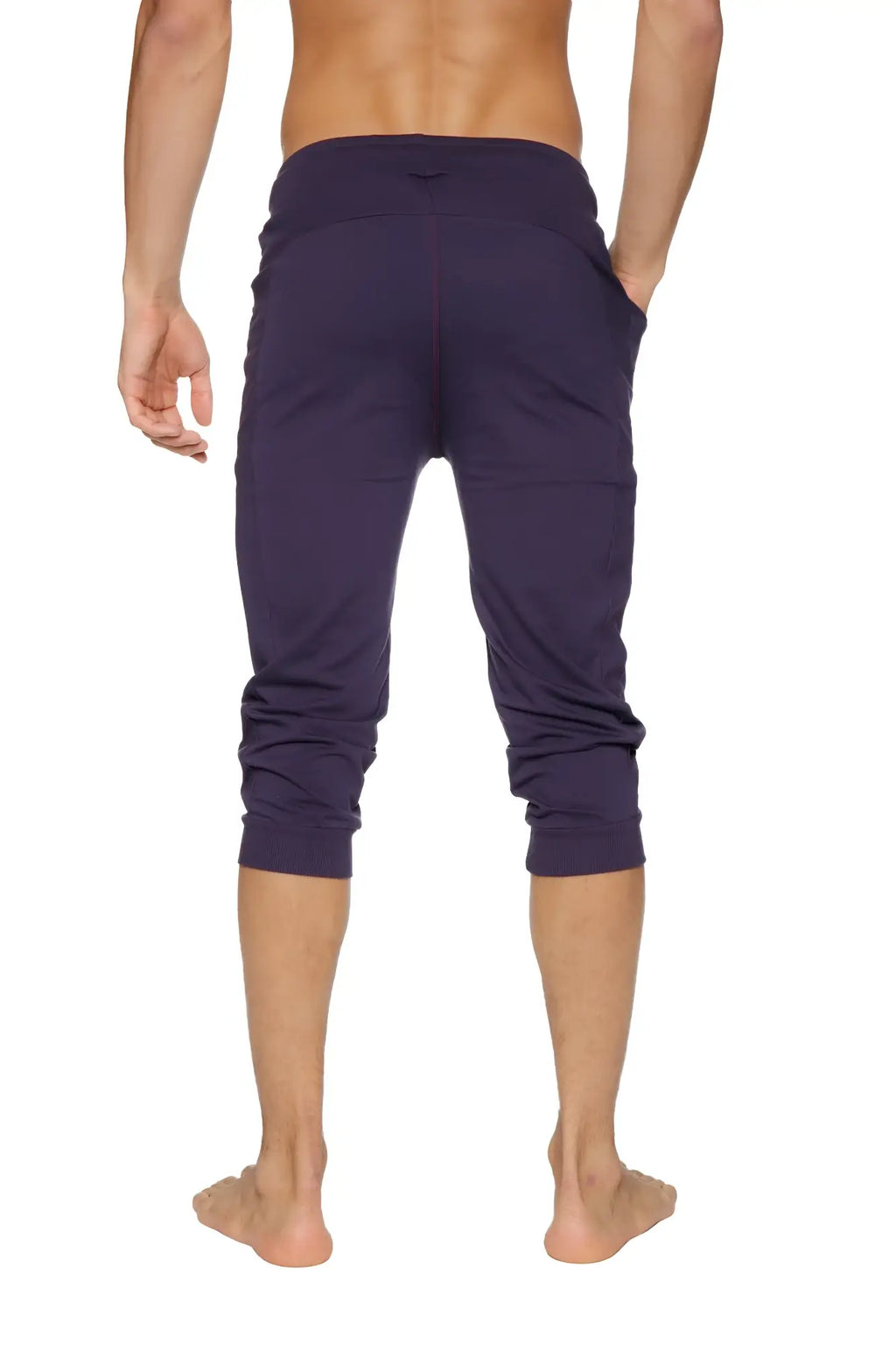 Dark purple cuffed yoga pants made of stretchy fabric with elastic waistband for comfortable wear