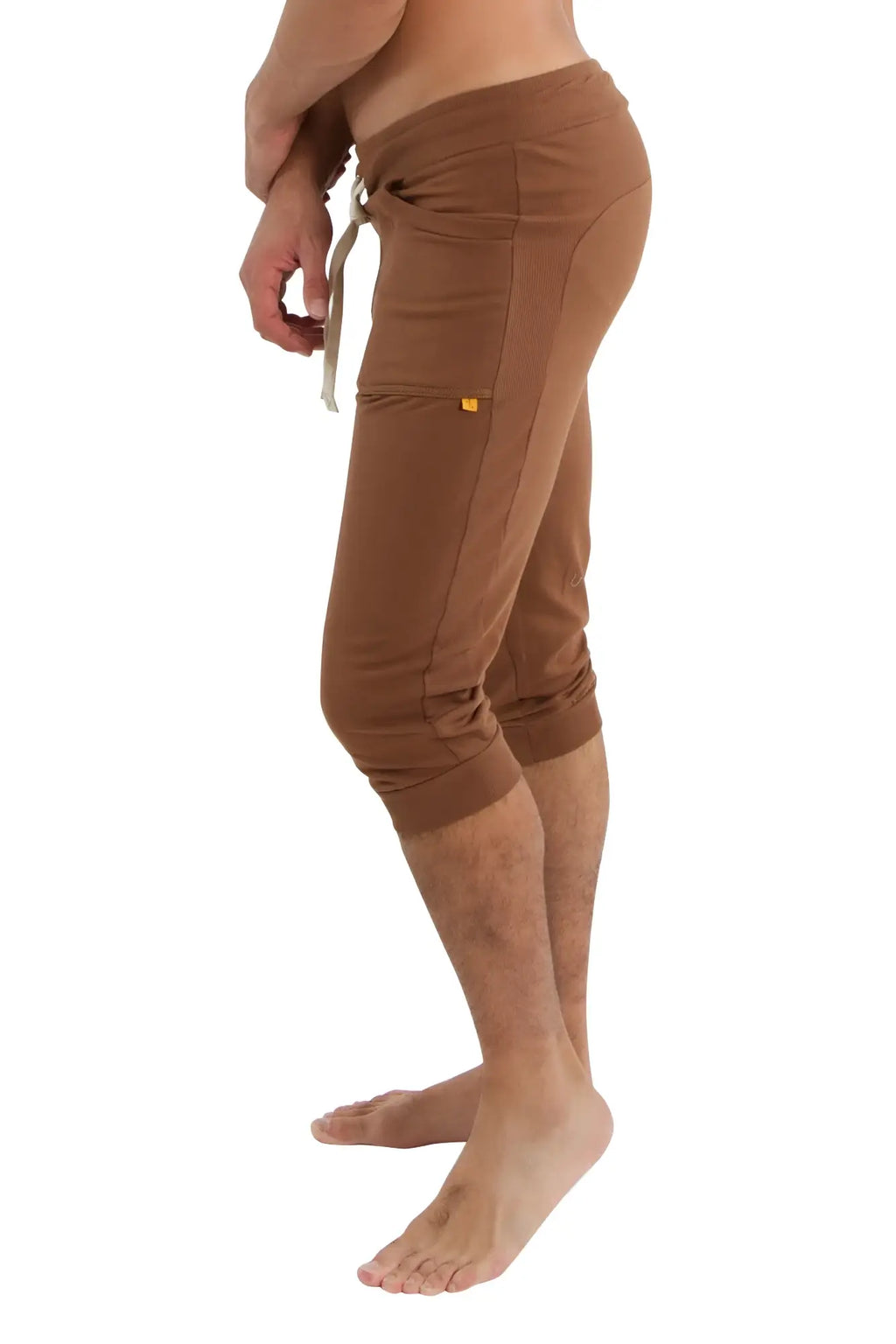 Brown cuffed yoga pants with drawstring waistband and side pockets in solid chocolate for athletic use