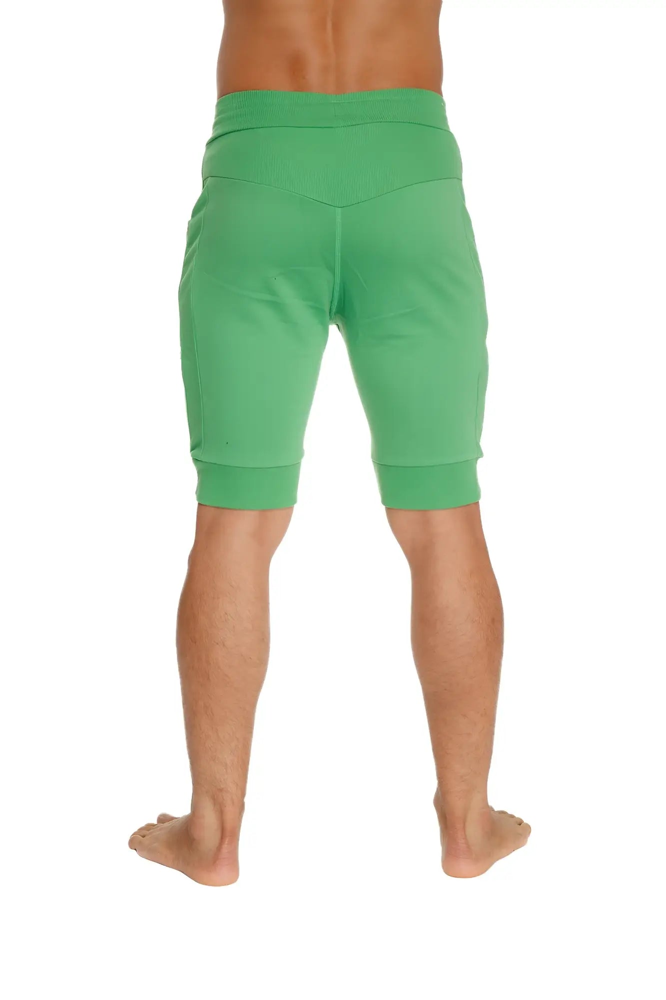 Cuffed yoga shorts in bamboo green with elastic waistband and ribbed cuffs for comfortable athletic wear