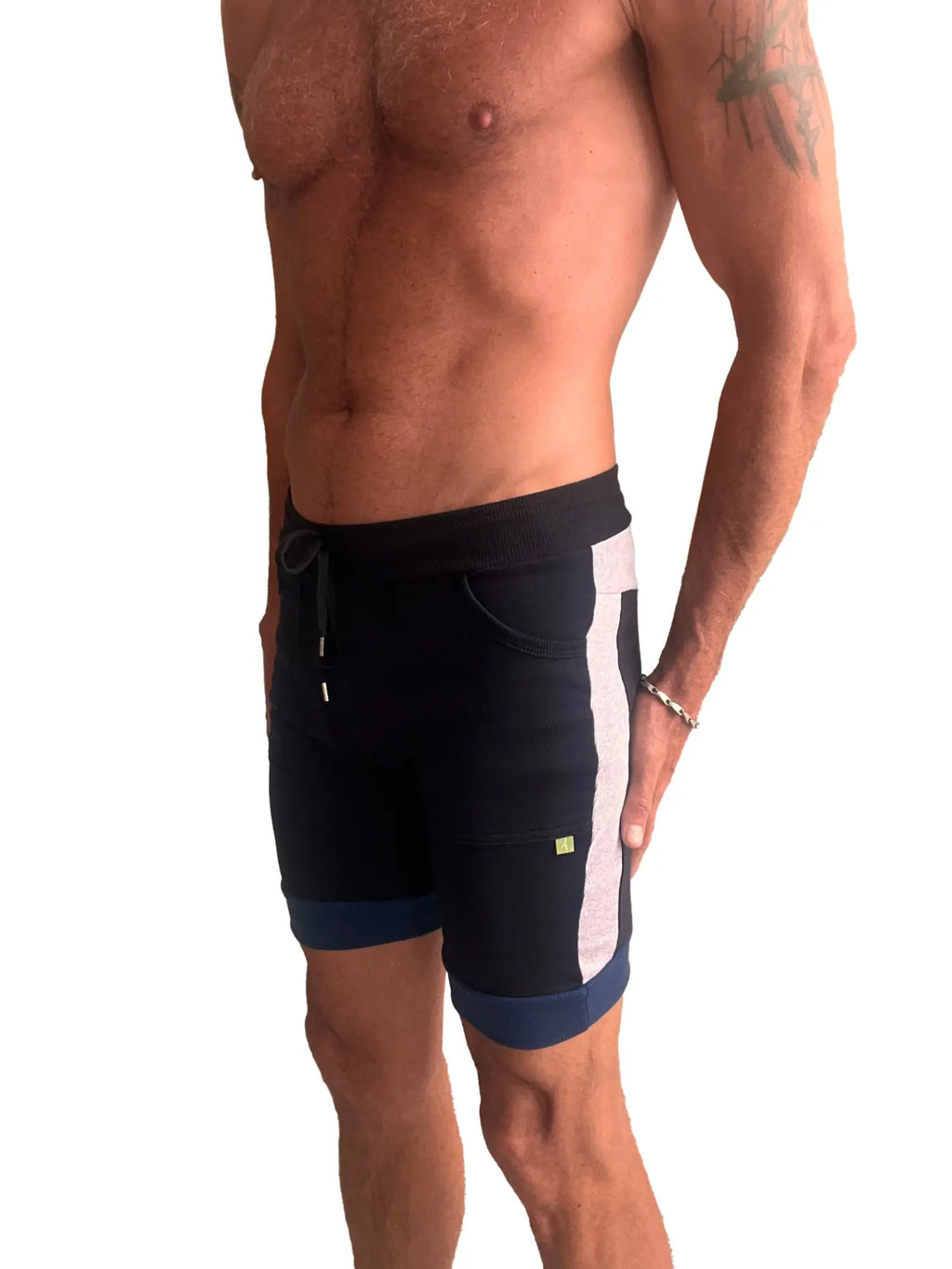 Black cuffed yoga shorts with white vertical stripe navy trim drawstring waistband and side pockets for athletic use
