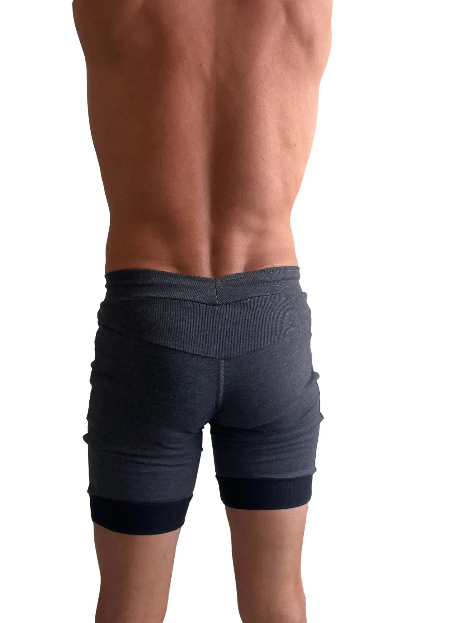 Cuffed yoga short in charcoal with black cuff featuring dark gray ribbed fabric texture and contrasting waistband and hem