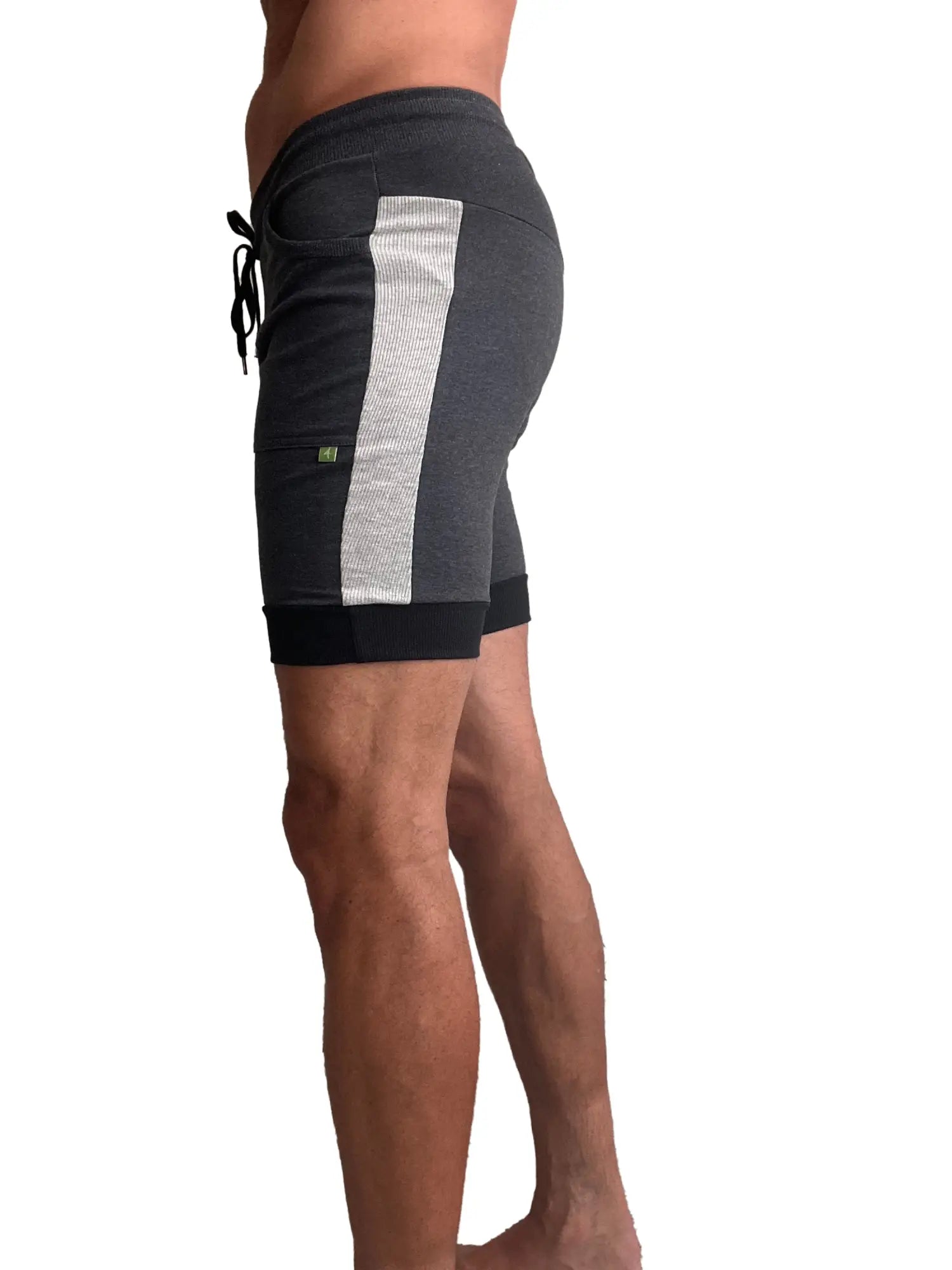 Dark gray cuffed yoga shorts with textured silver stripe and black drawstring waistband for athletic use