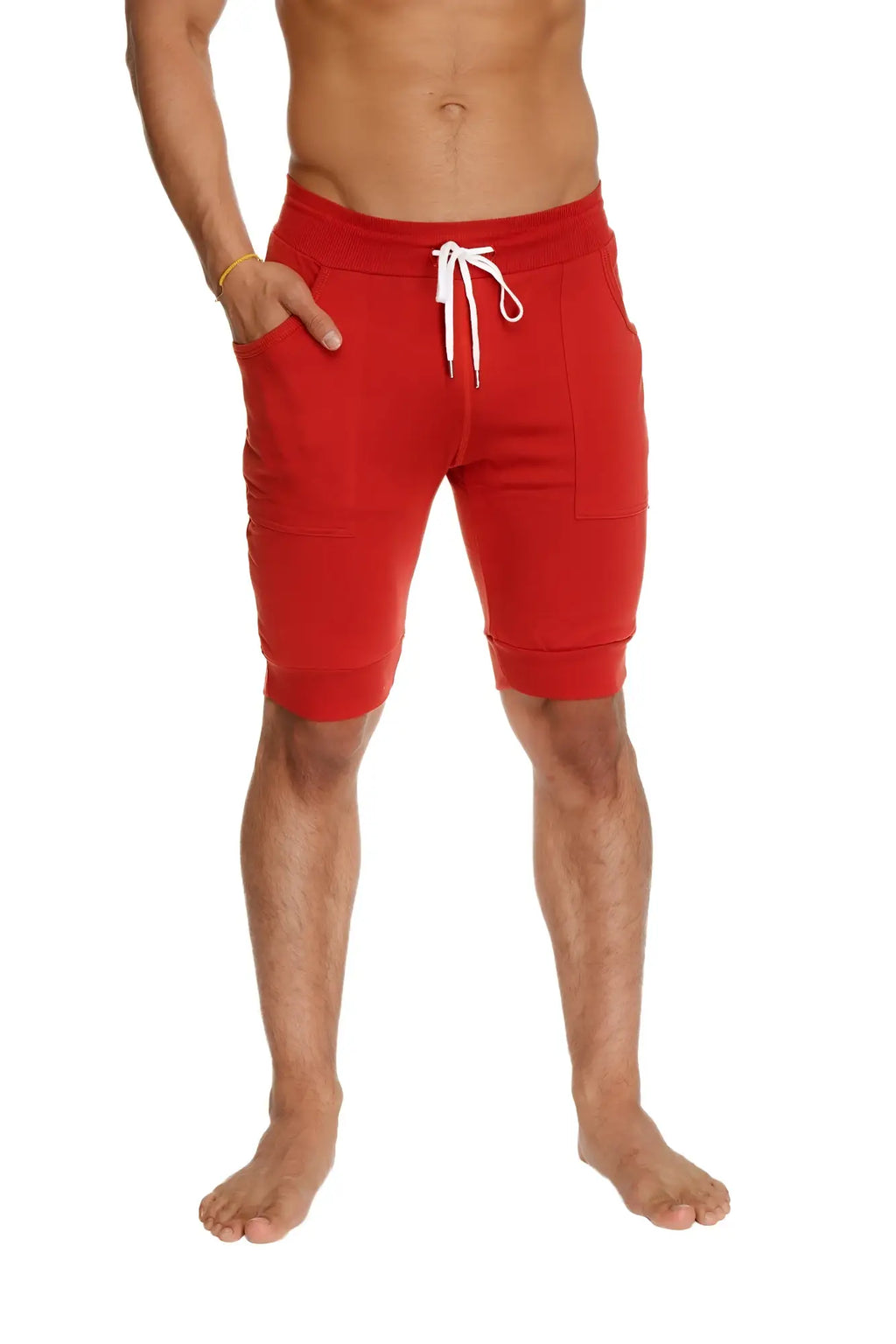 Red cuffed yoga shorts with white drawstring and side pockets designed for comfort and active wear