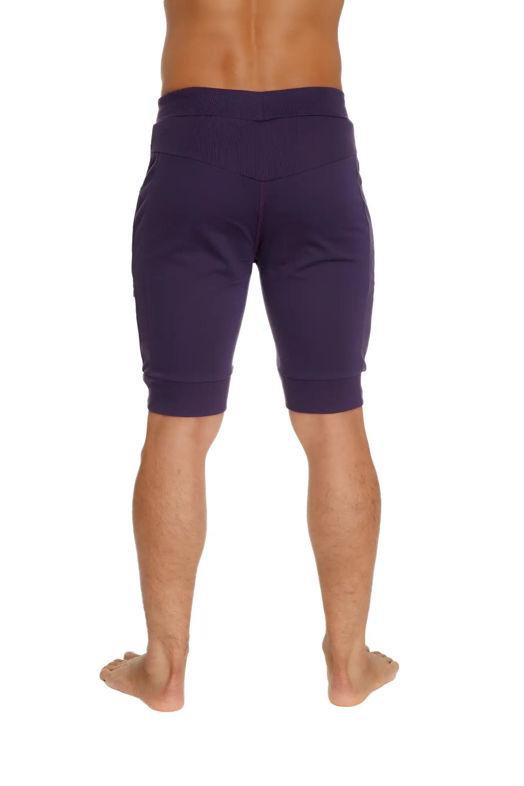 Purple cuffed yoga shorts with elastic waistband and ribbed cuffs for comfortable athletic wear