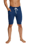 Cuffed yoga short in royal blue with navy blue fabric white drawstring and side pockets for athletic use