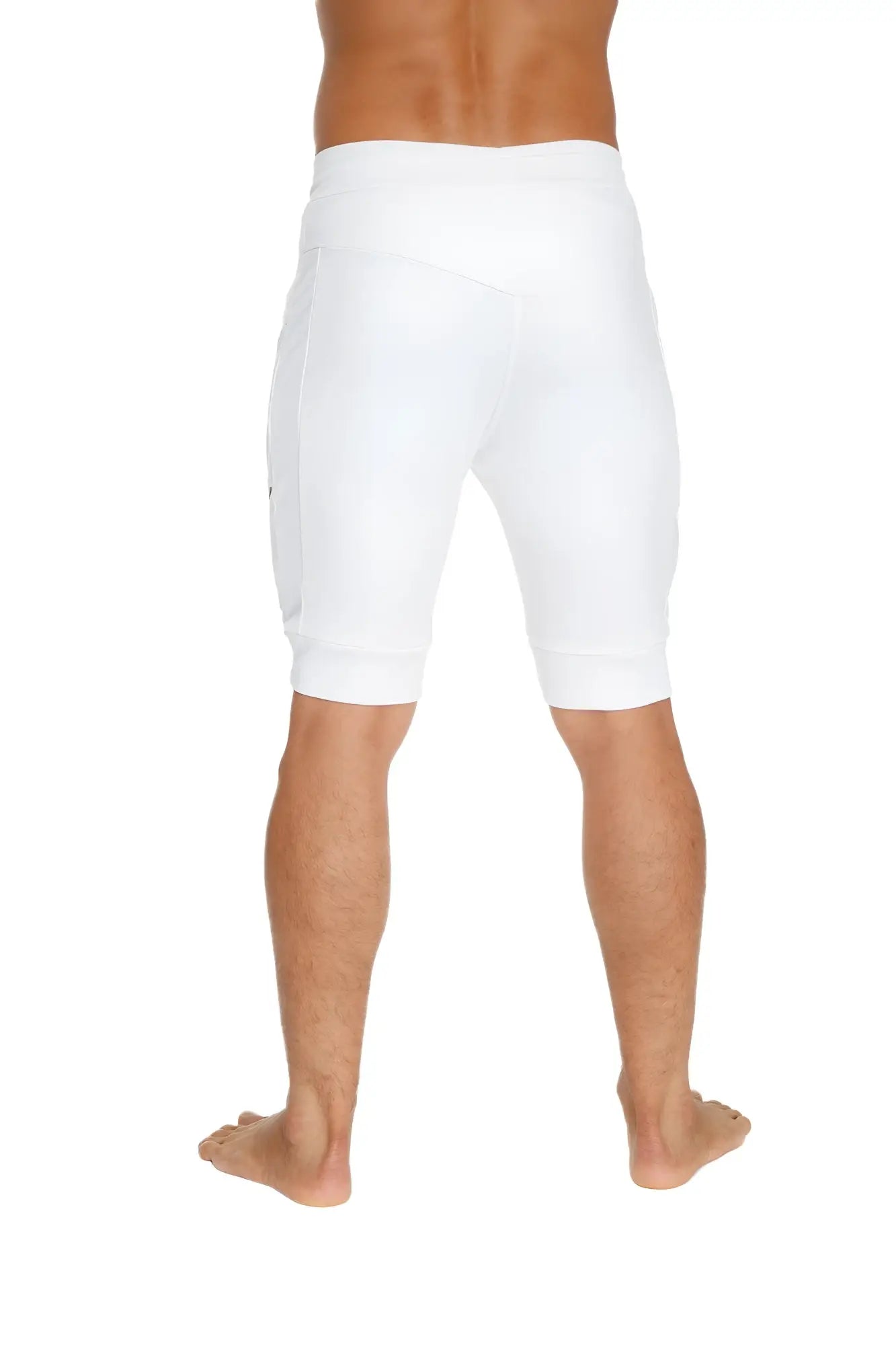 White cuffed yoga shorts with a snug fit and side pockets designed for athletic wear and comfort