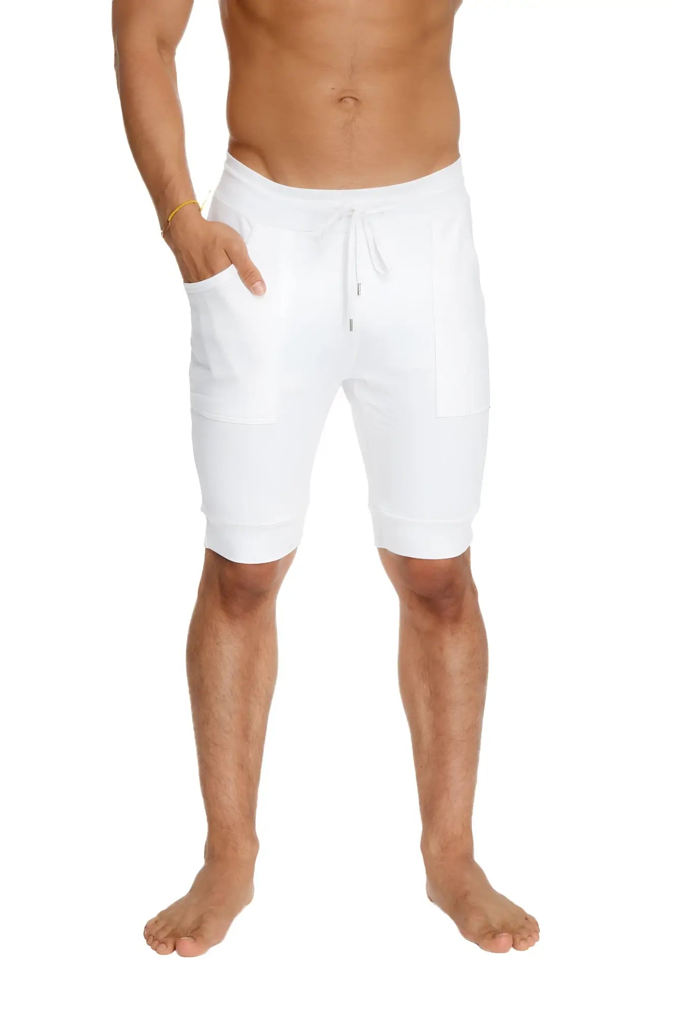 White cuffed yoga shorts with a relaxed fit drawstring waist and side pockets for comfortable activewear