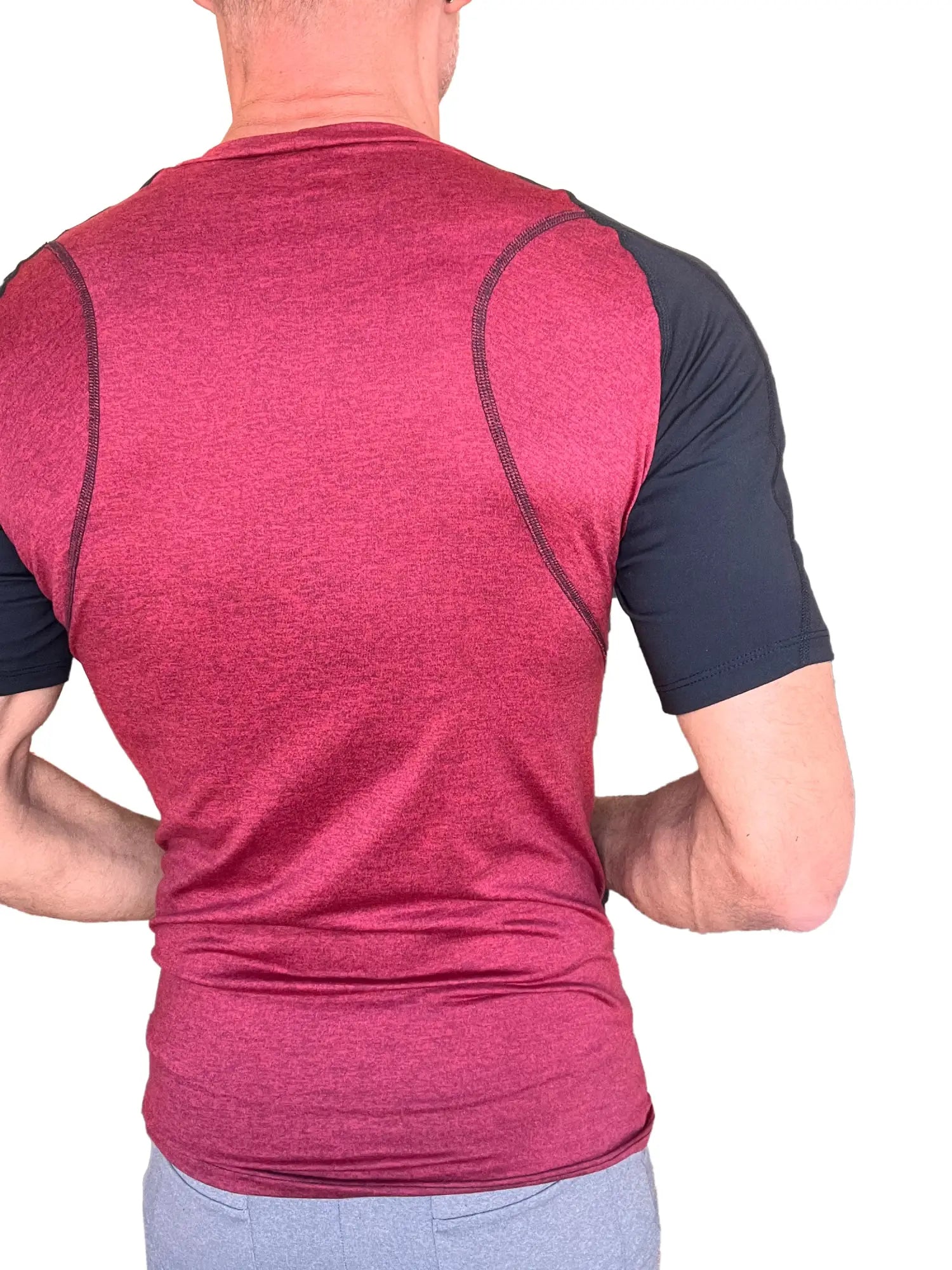 Designer raglan crew-neck tee in brick with black sleeves featuring a heathered texture and contrasting seams