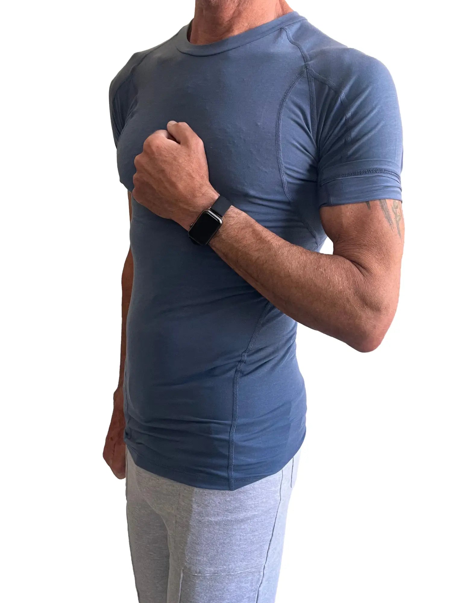 Designer raglan crew-neck tee in denim blue featuring a fitted, performance-style athletic short-sleeved shirt design