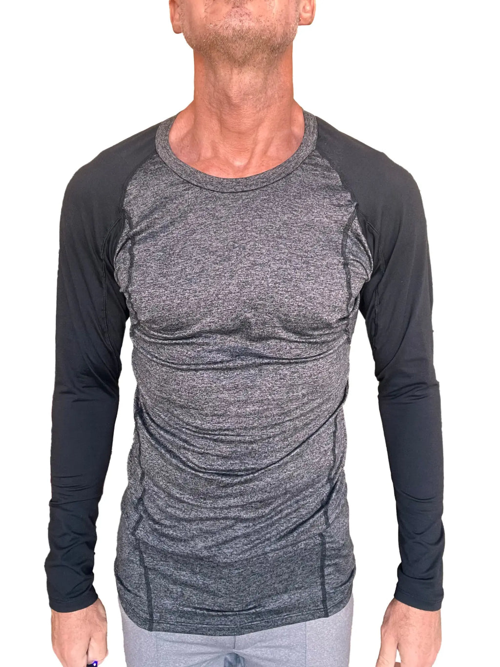 A men’s long-sleeved designer raglan crew-neck tee with heather gray torso and black fitted sleeves for active wear