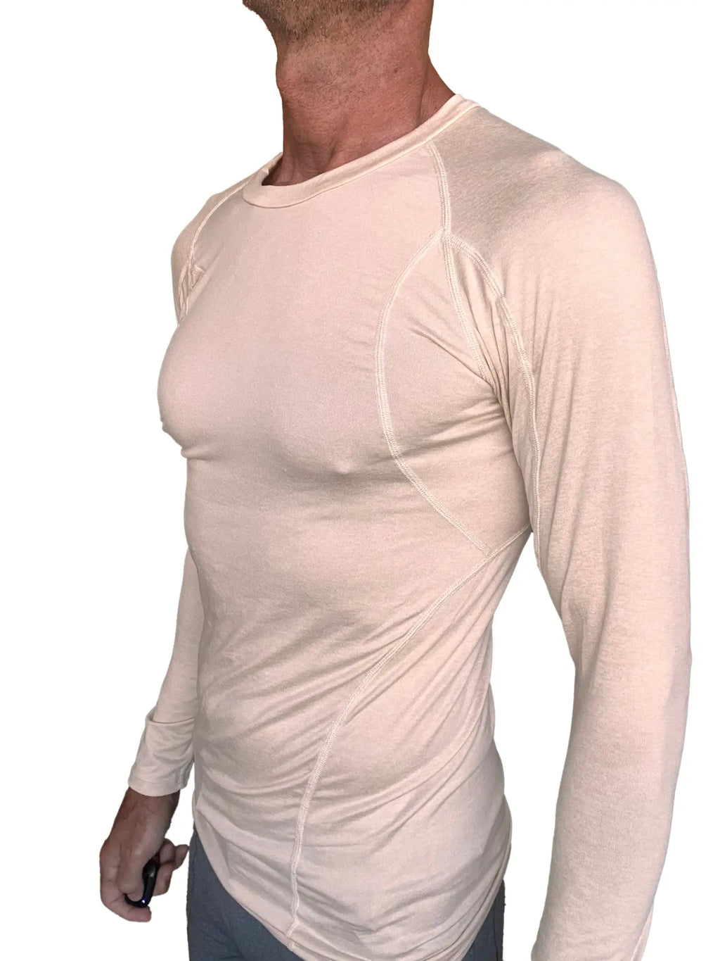 Beige long-sleeved designer raglan crew-neck performance shirt with subtle seam detailing in sand beige color