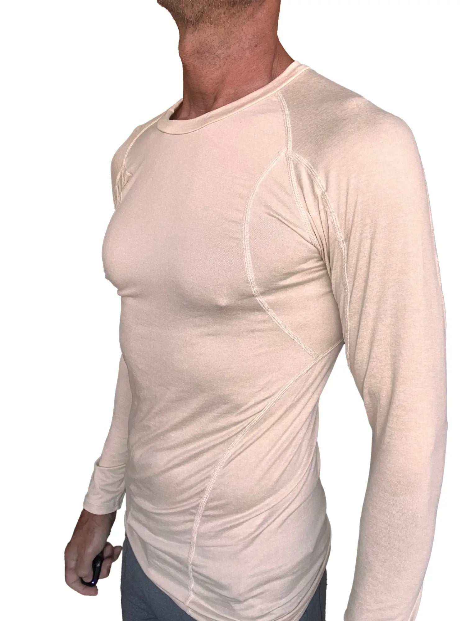 Beige long-sleeved designer raglan crew-neck performance shirt with subtle seam detailing in sand beige color