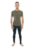 A man wearing an olive green fitted short-sleeved compression shirt paired with black leggings