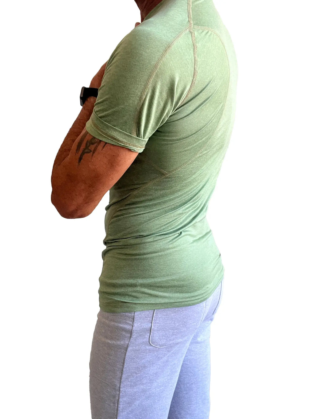 A light green designer raglan crew-neck tee with a fitted cut and subtle seam detailing for athletic wear