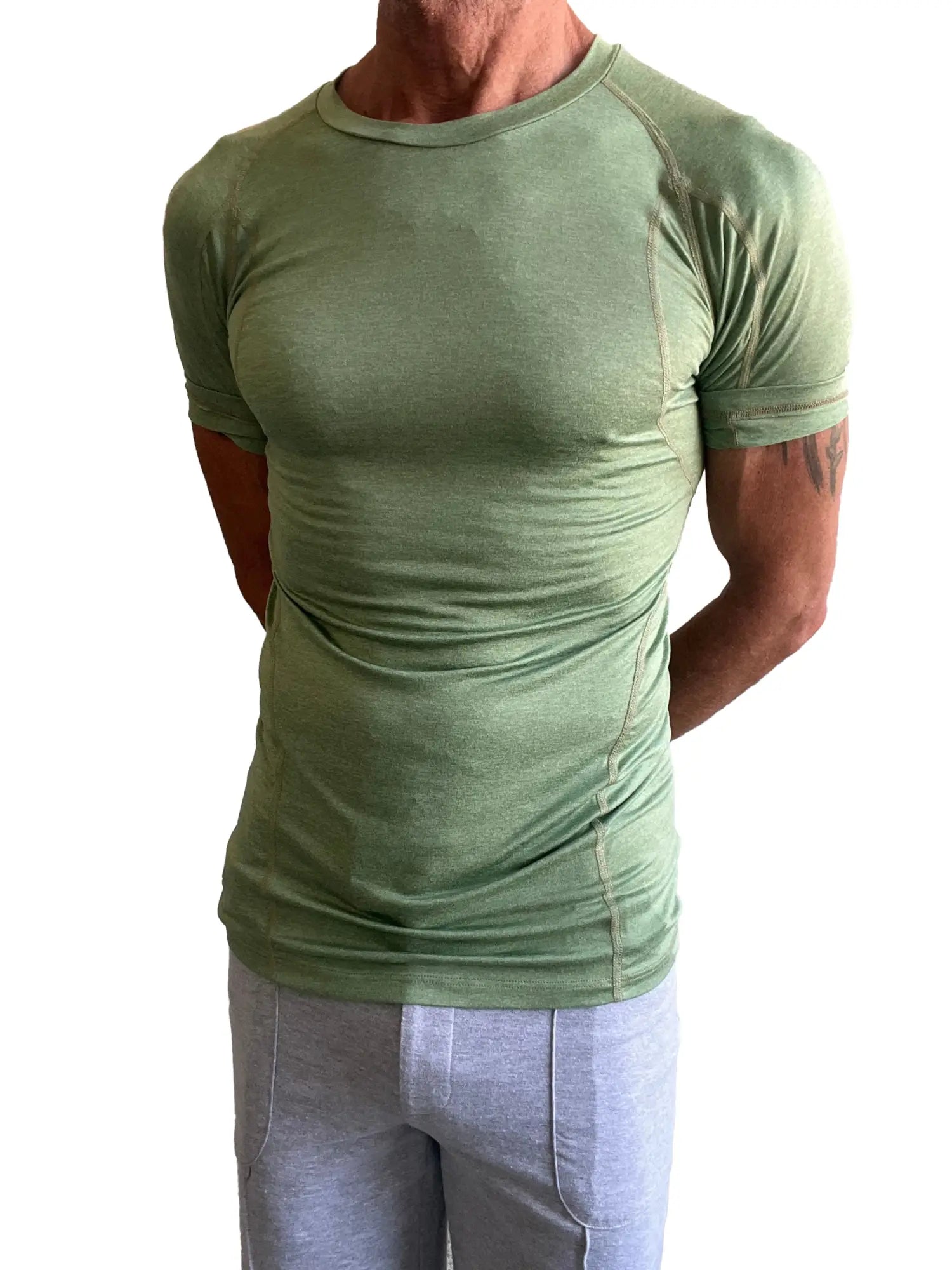 Designer raglan crew-neck tee in sage green olive with short sleeves and subtle seam detailing for athletic wear