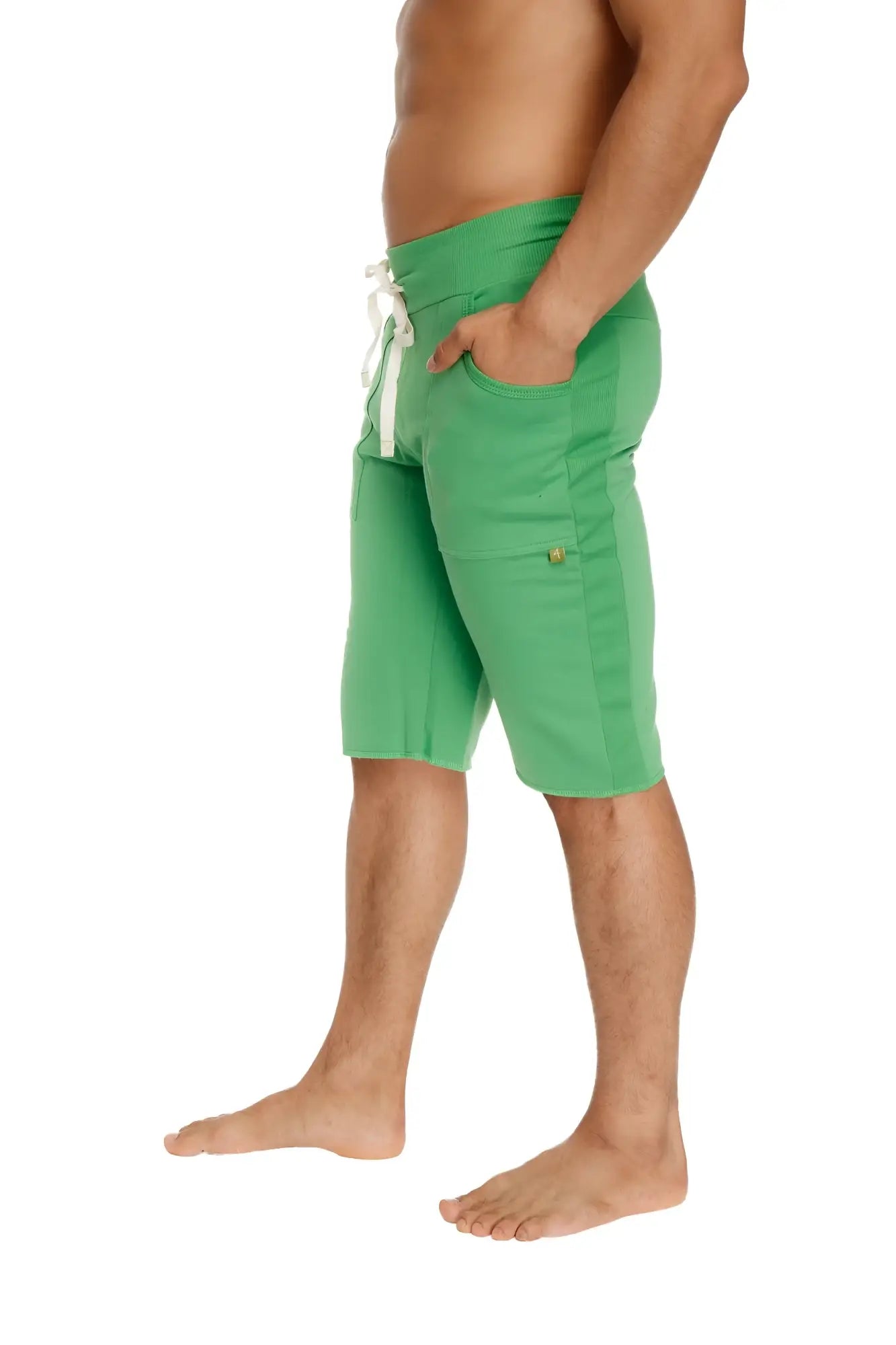 Eco-track short bamboo green athletic shorts in green with white drawstring and gold button on side pocket