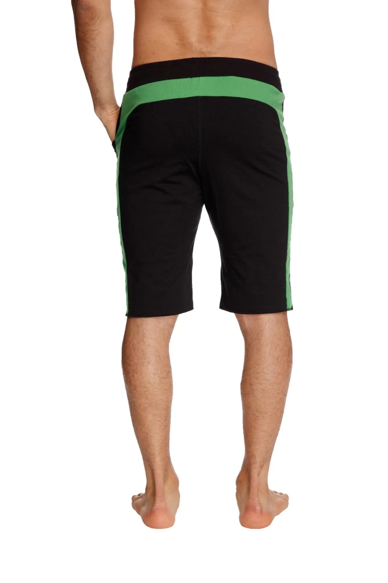 Eco track short in black with bamboo green waistband and vibrant green side stripes made from sustainable fabric