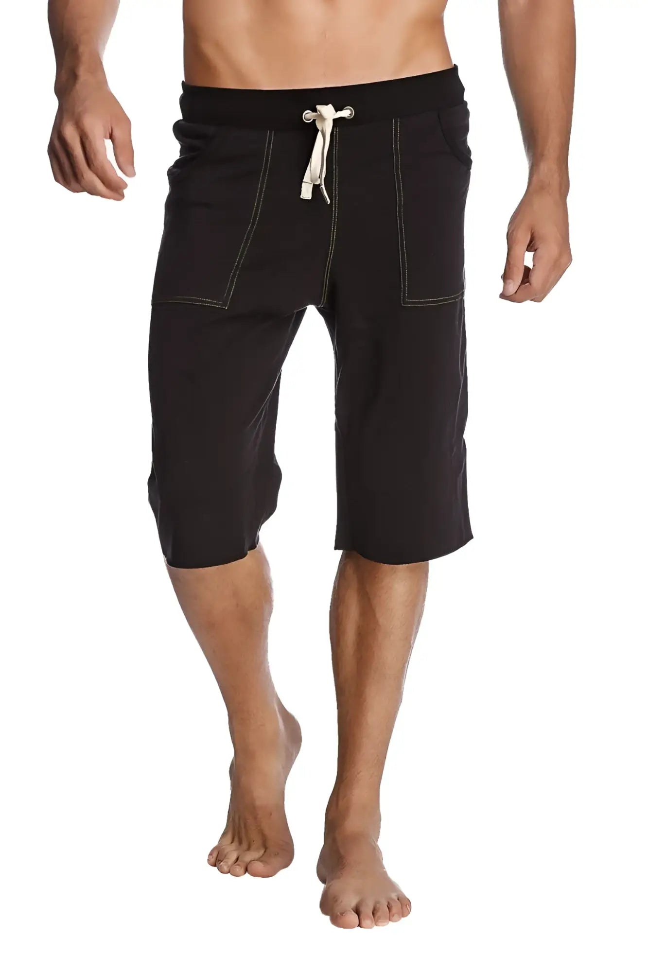 Black eco-track shorts with bamboo green drawstring, contrasting white stitching, and side pockets for active use