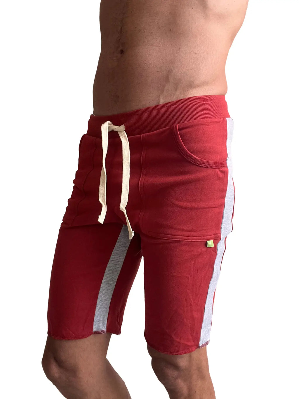 Eco-track short in cinnabar red with white and gray side stripes and drawstring waistband for athletic use
