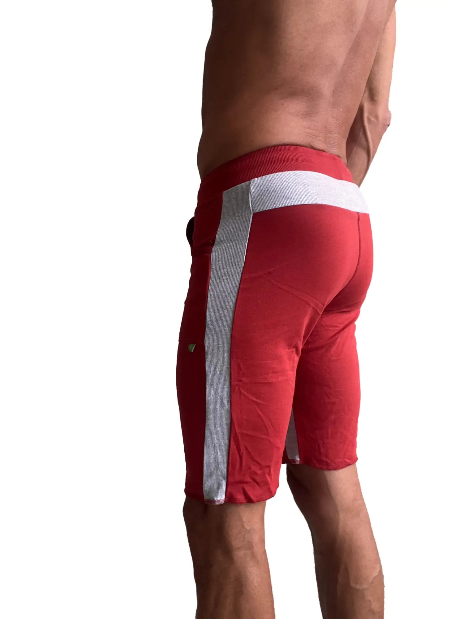 Red eco-track athletic shorts with white and silver striped side panels designed for active use