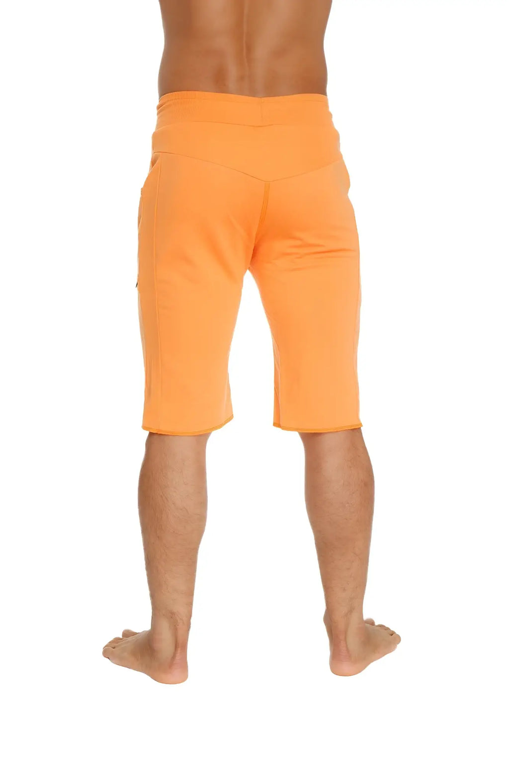 Eco-track short in sun orange featuring relaxed fit and side pockets made from sustainable material