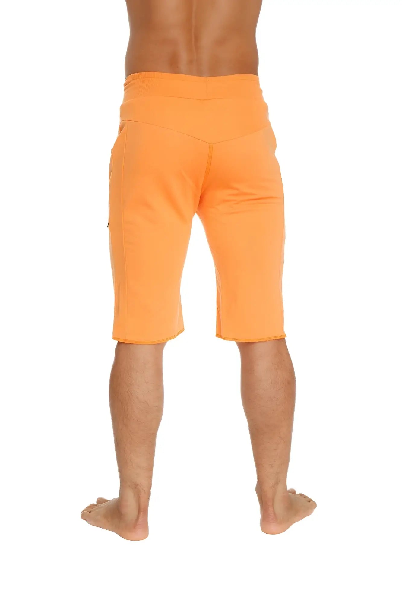 Eco-track short in sun orange featuring relaxed fit and side pockets made from sustainable material