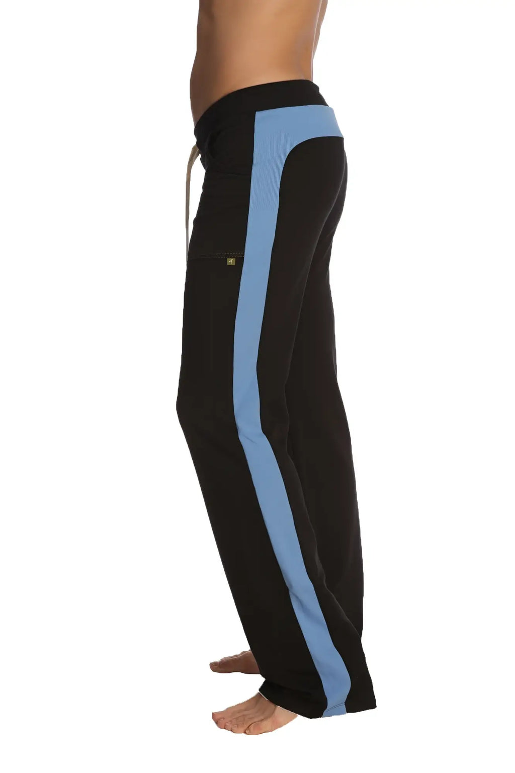 Black eco-track and yoga sweat pants with light blue side stripe, elastic waistband, and thigh logo patch