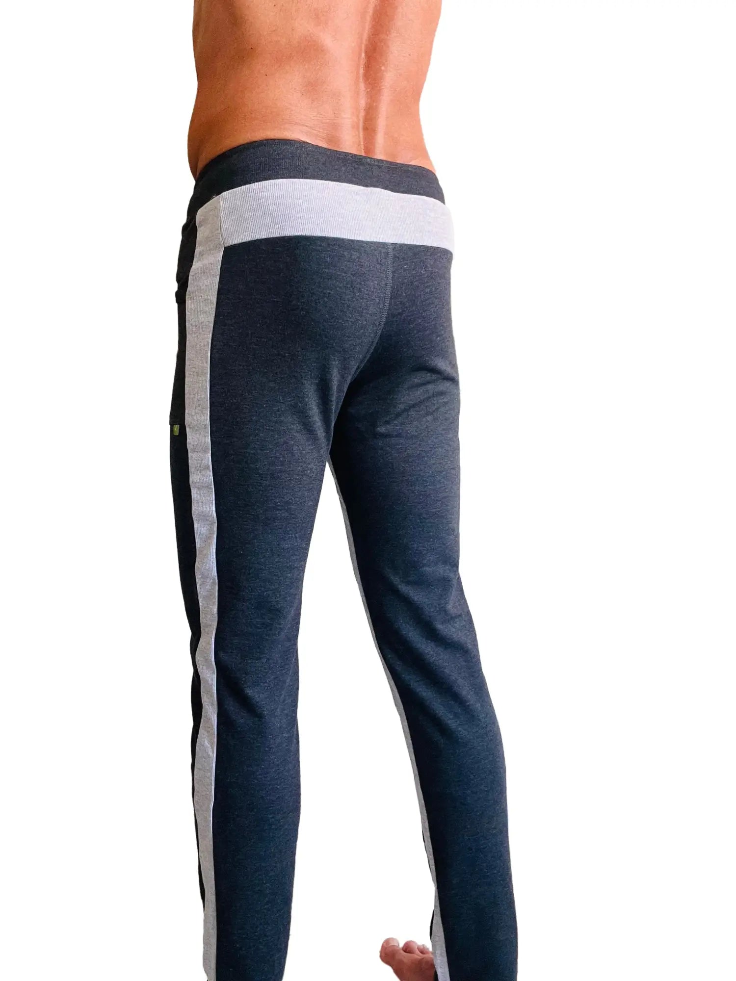 Dark heathered blue eco-track and yoga sweat pants with light gray and black side stripes and a white ribbed waistband