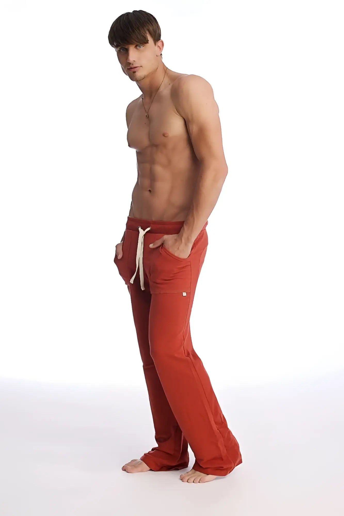 Red eco-track and yoga sweat pant cinnabar with white drawstrings and side pockets made from sustainable material