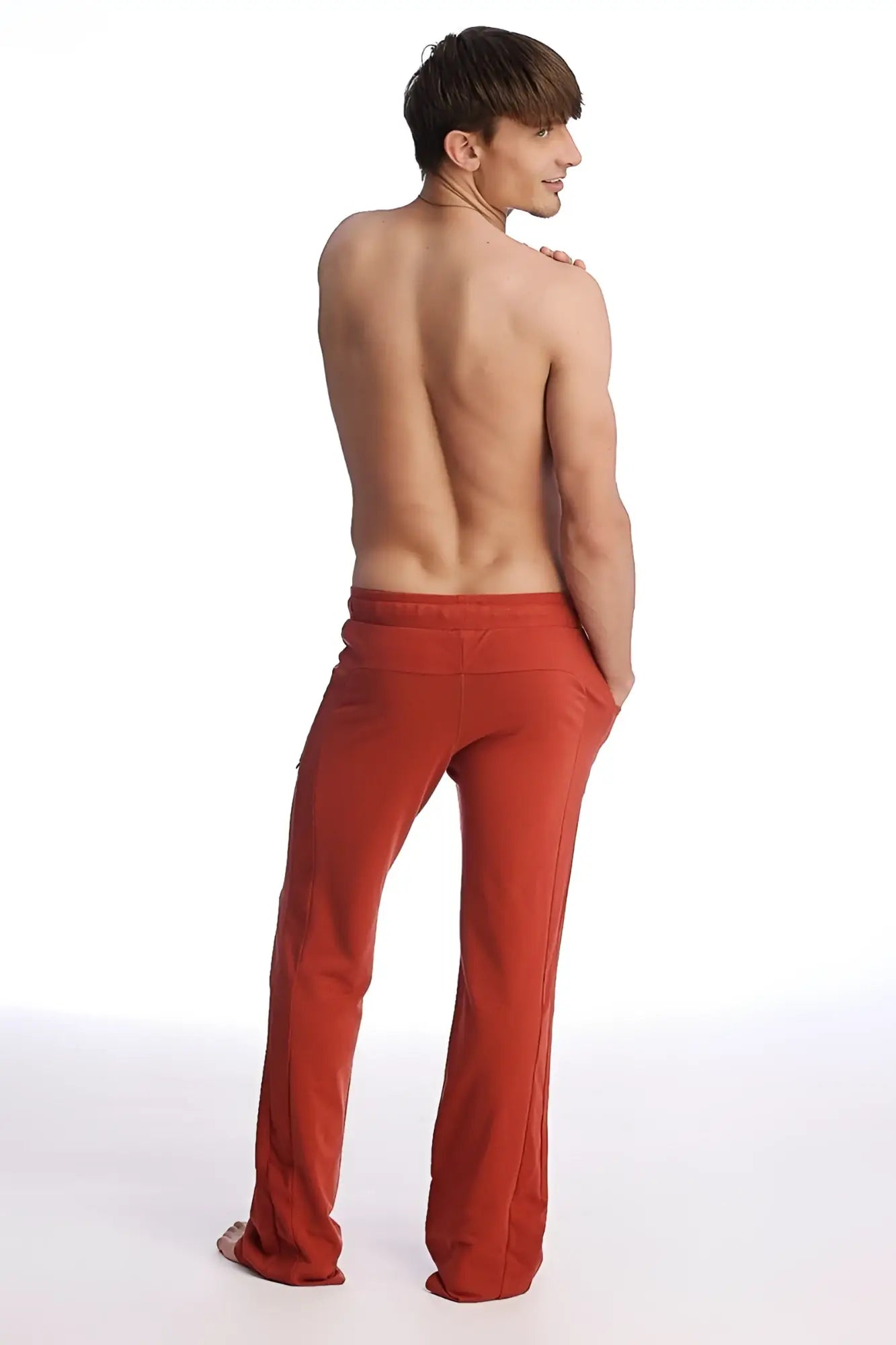 Red eco-track and yoga sweat pant with loose fit, straight leg cut, and elastic waistband in cinnabar color