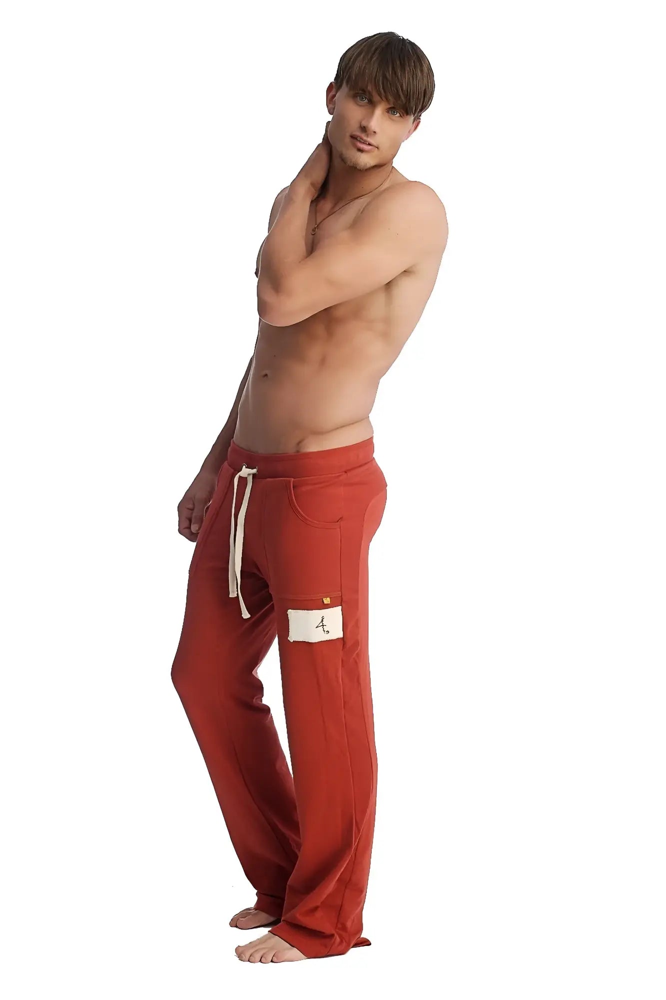 Red cotton edge eco-track and yoga sweat pant in cinnabar with white drawstrings and patch on left thigh