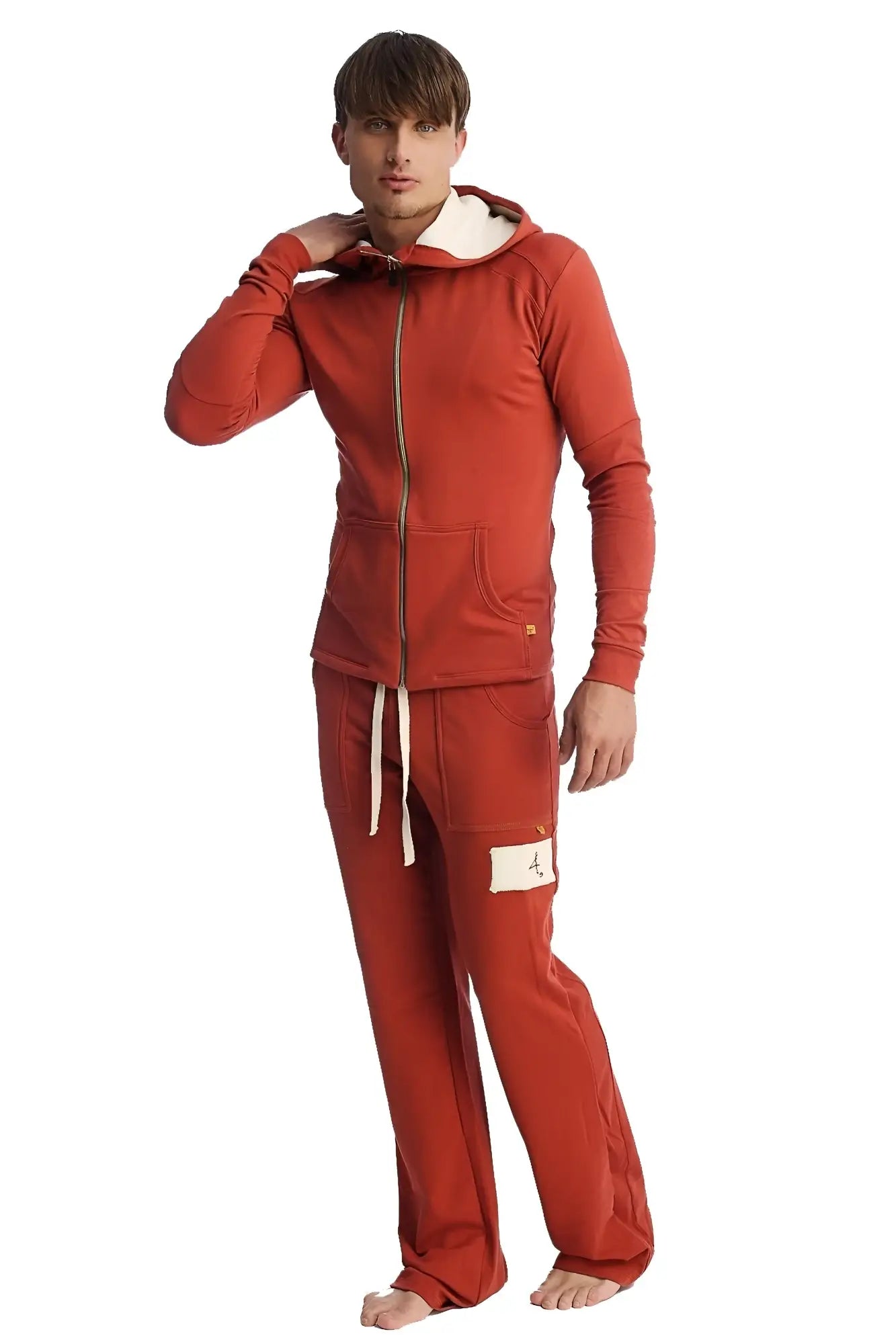 Red hooded sweatshirt with gold zipper and white drawstrings paired with cinnabar edge eco-track yoga sweat pant