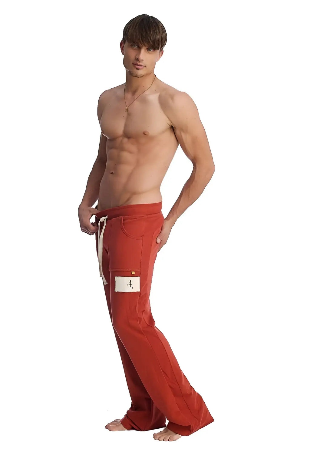 Edge eco-track and yoga sweat pant in cinnabar featuring red loose-fitting fabric white drawstring and thigh patch