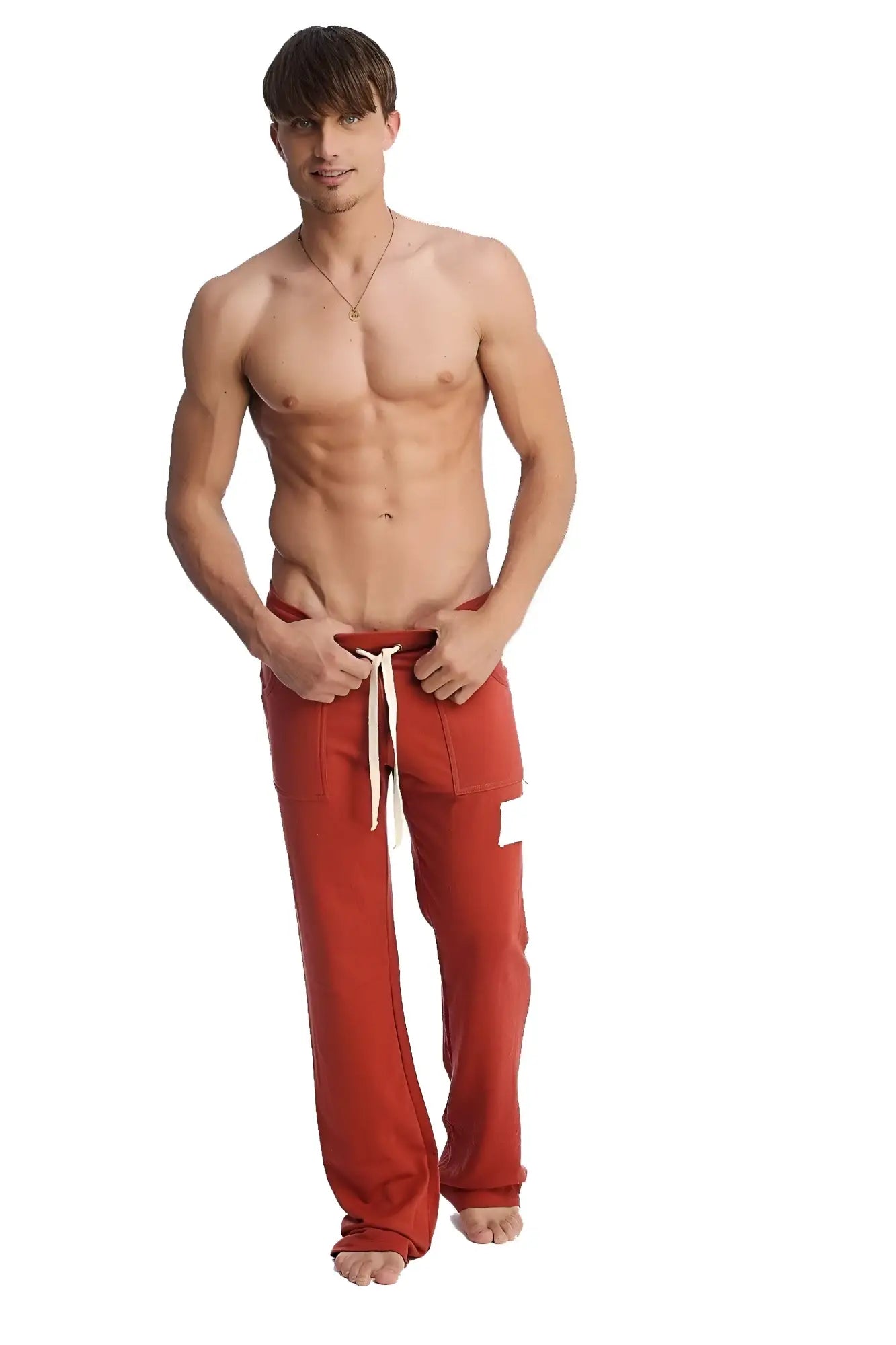 Edge eco-track and yoga sweat pant in cinnabar red with white drawstrings and a small white patch on the left thigh