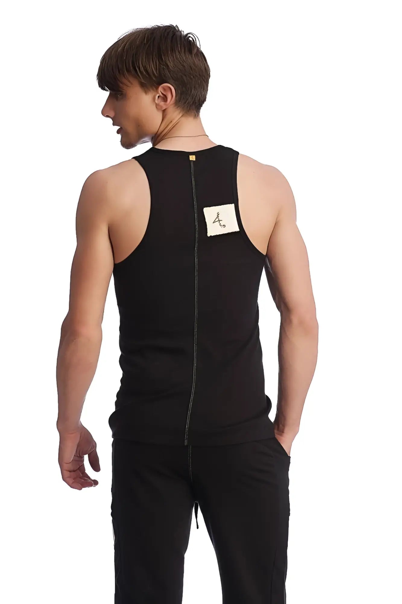 Back view of black edge sustain tank top with sleeveless design and central zipper made of breathable fabric